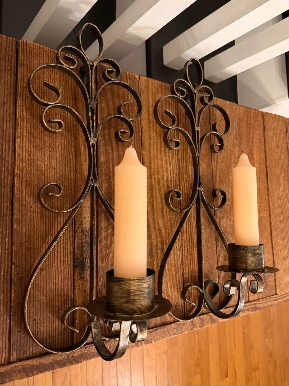 Rustic Scroll Metal Wall Sconce Pair with Cream Candles